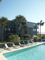 Laundry room look over to Trina's balcony; pool; & ocean.