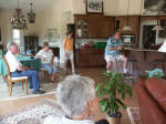 Nancy walks into the kitchen past Bill, Linda, Martha, & Joe. 