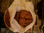 Homemade raisin bread in a turkey-weave basket.