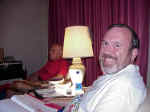 Joe Barrett, with Daddy in background, at devotions in our room