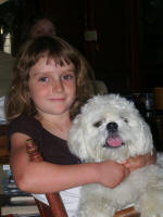 Alana holding Corey, in front of Anna.