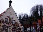 From the heart of the city, the marketplace, looking up past the Renaissance town hall to the covered wooden bridge on the hilltop.