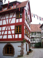 Decorative half-timbered construction and quoins (prominent stones at wall corners or door and window openings) of the Jgerhusle, built into the city wall of this perfectly preserved town in the Kinzig Valley surrounded by sunny forested slopes & shady valleys.