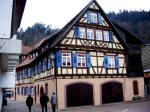 Gertrud, Eugen, and Elfriede walking outside the town wall in the Gerberviertel, the tanner's quarters, past the town's second mill, the uere Mhle, and it is the oldest half-timbered house in Schiltach, built in 1557.