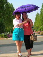 Ruth and Vi walk toward the Garden entrance.